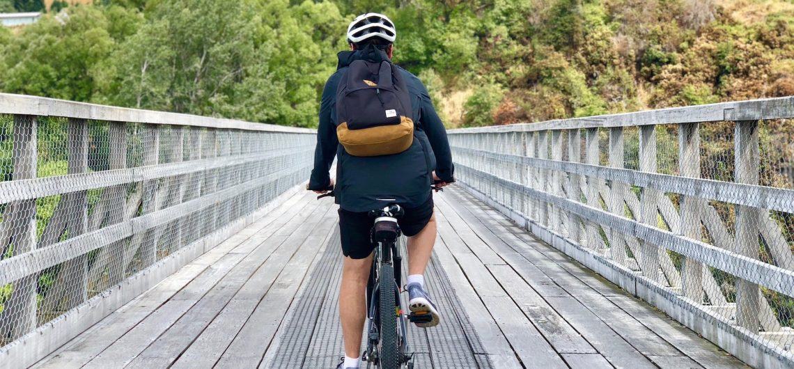 Biking over the Old Shotover Bridge near Queenstown