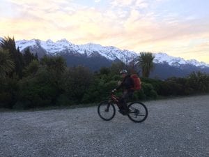 Leif E-biking to a hut after work